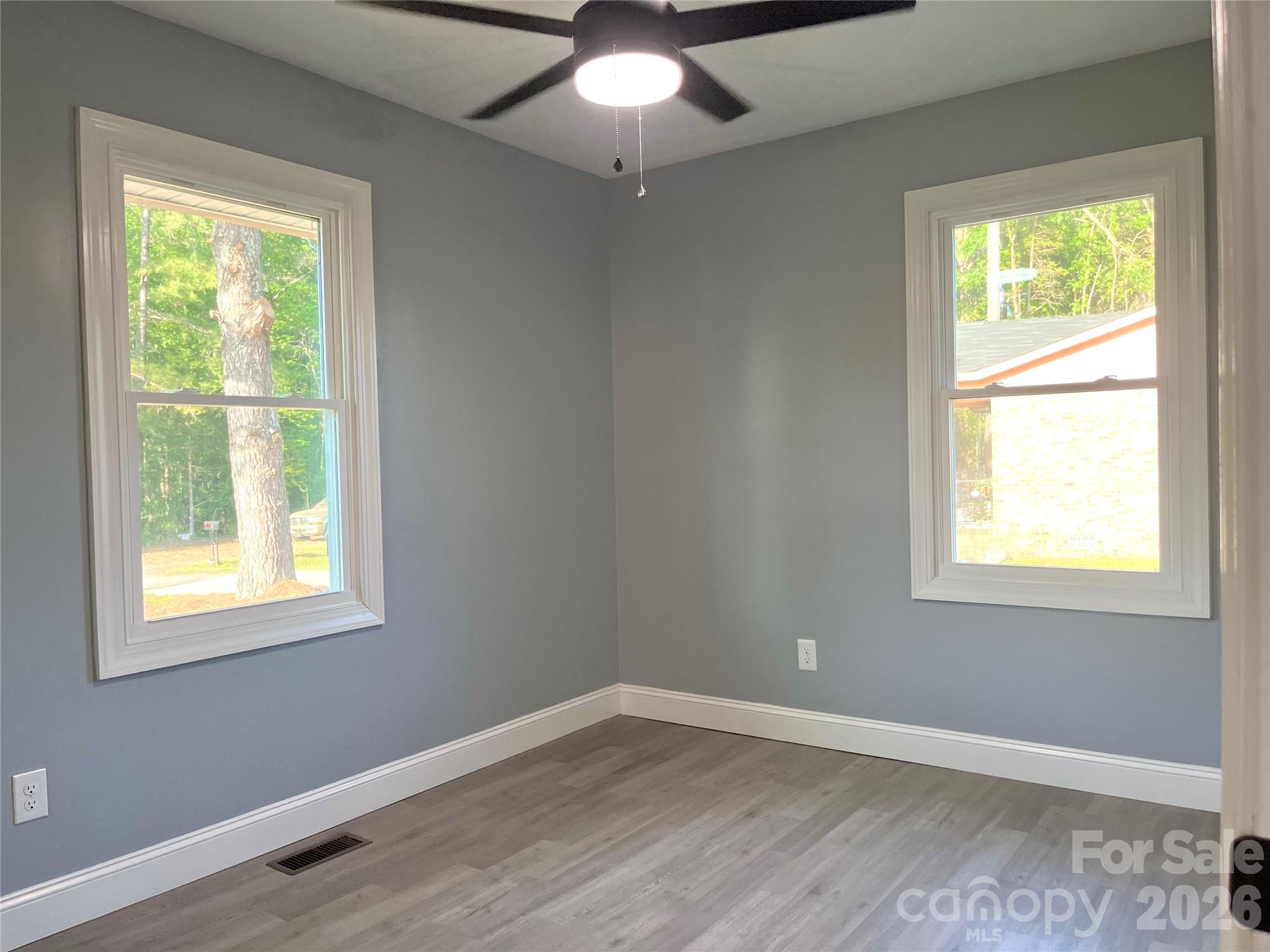 102 Arbor Court Chester, SC 29706 - Photo 29 of 42 a view of an empty room with wooden floor and a window