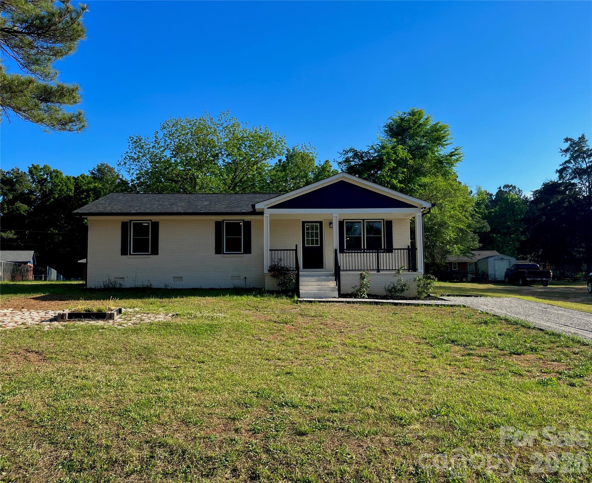 102 Arbor Court Chester, SC 29706 - Photo 3 of 42 a front view of a house with a garden