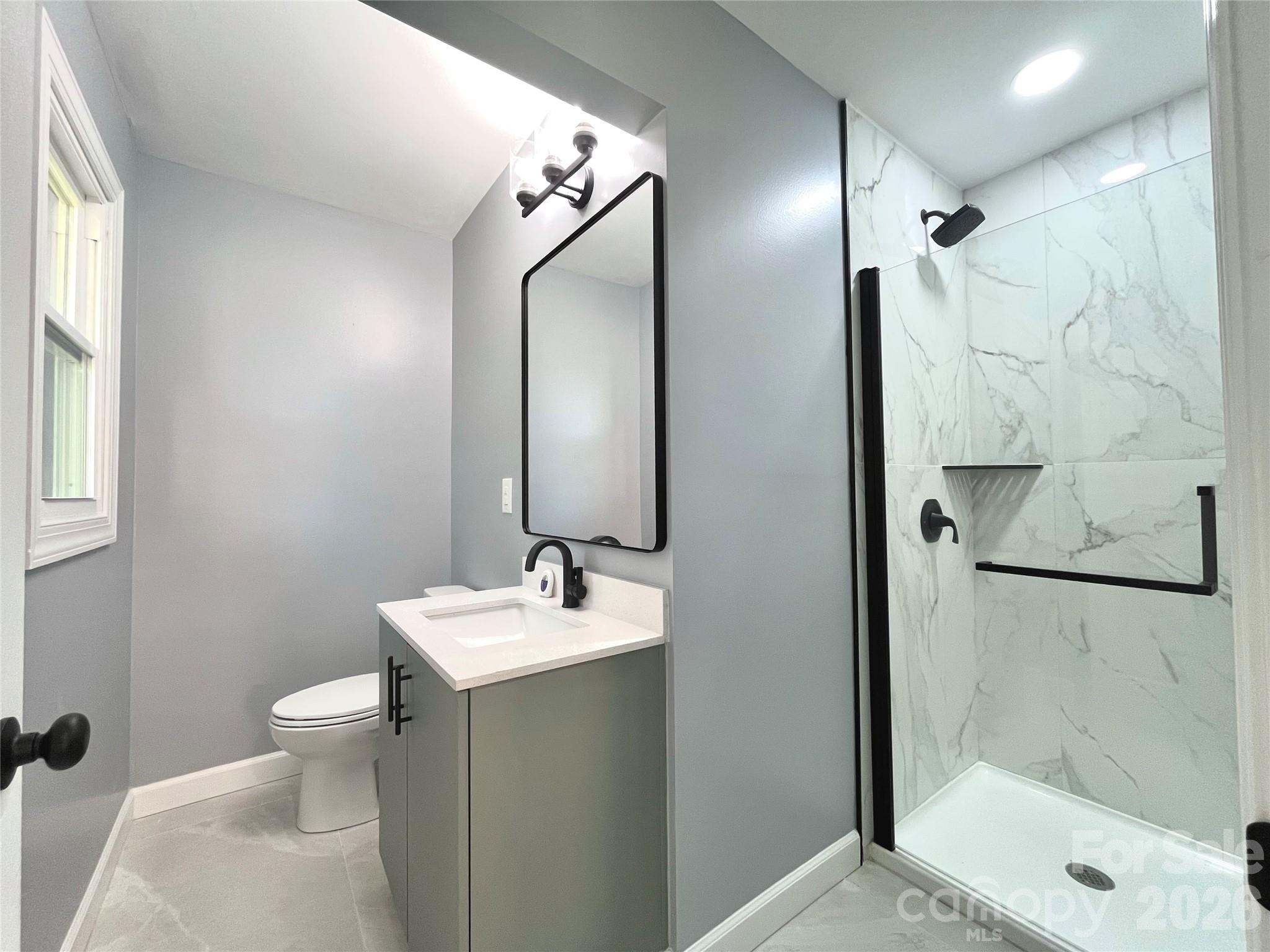 102 Arbor Court Chester, SC 29706 - Photo 35 of 42 a bathroom with a sink toilet and shower