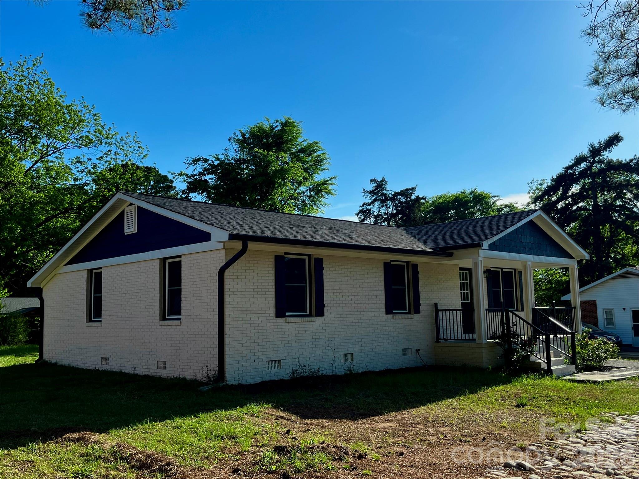 102 Arbor Court Chester, SC 29706 - Photo 7 of 42 a view of a white house with yard and sitting area