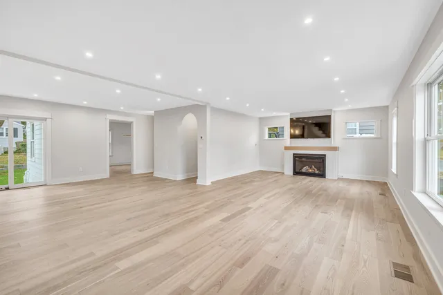 a kitchen with stainless steel appliances granite countertop white cabinets and a sink