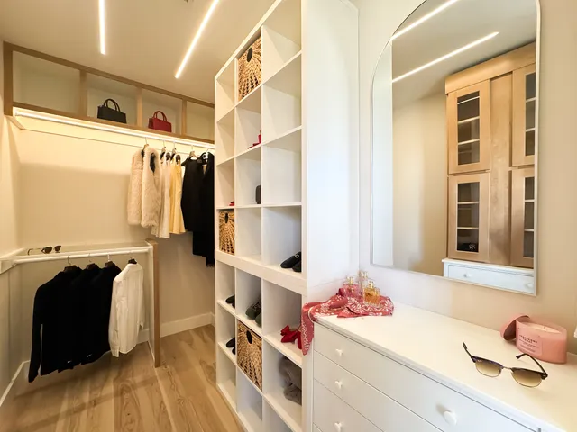 a bathroom with a double vanity sink mirror and toilet