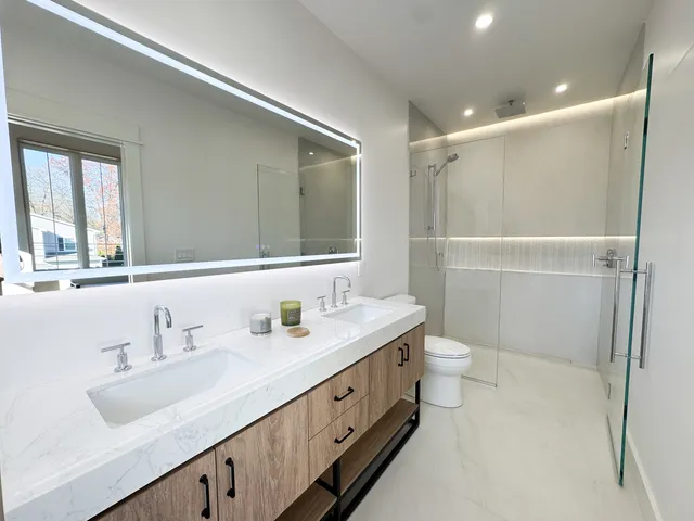 a bathroom with a glass shower door