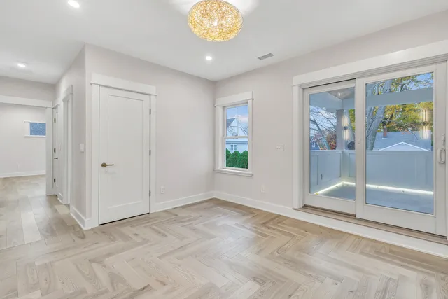 a kitchen with a table and chairs