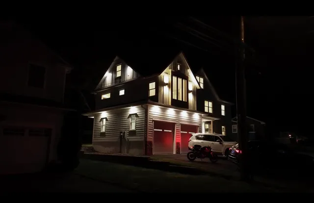 a front view of a house with yard