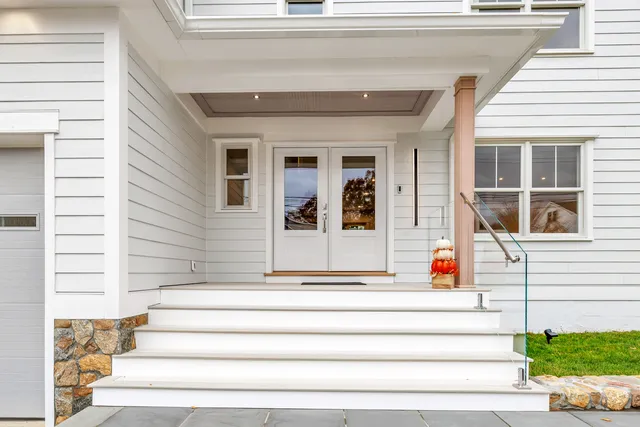 a front view of a house with a porch