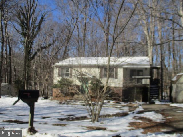 8520 Pine Boulevard Lusby, MD 20657 - Photo 2 of 13 a front view of a house with trees