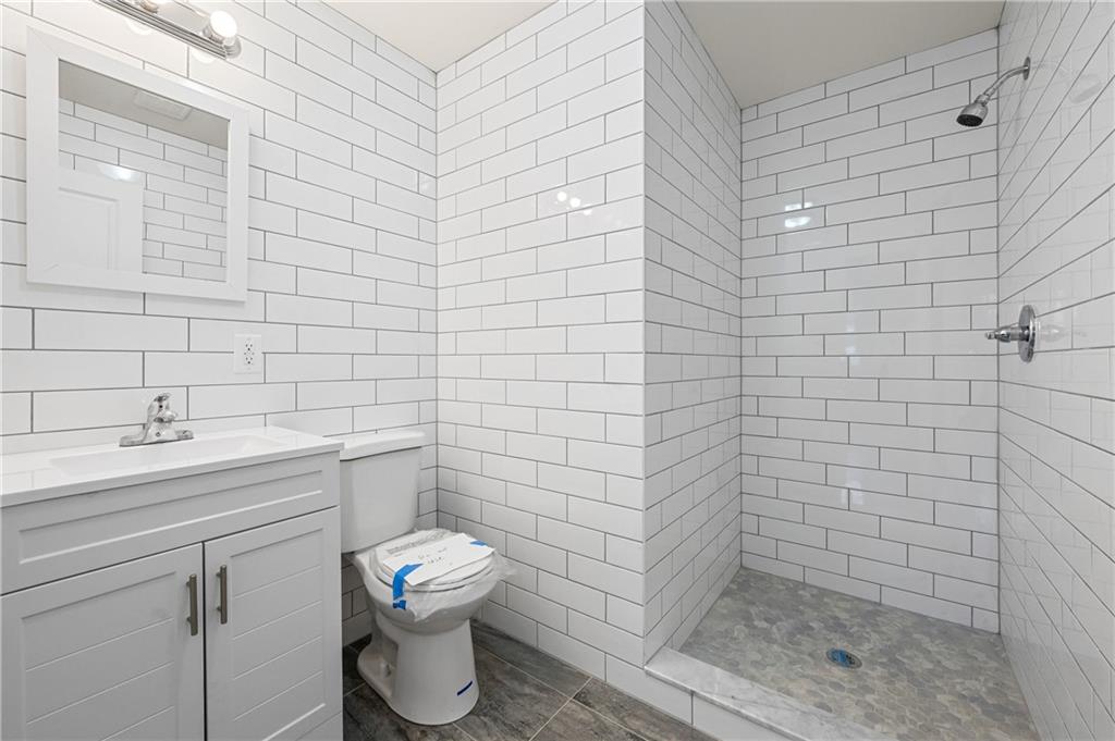 2167 West 13th Street Brooklyn, NY 11223 - Photo 11 of 35 a bathroom with a sink and toilet