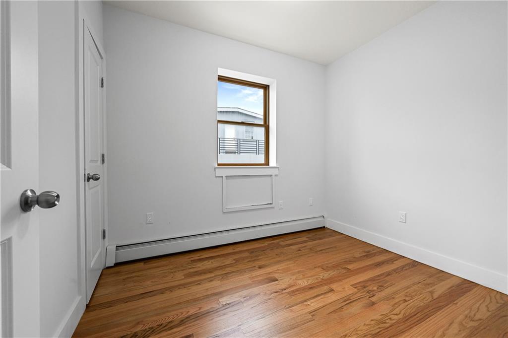 2167 West 13th Street Brooklyn, NY 11223 - Photo 26 of 35 an empty room with a window
