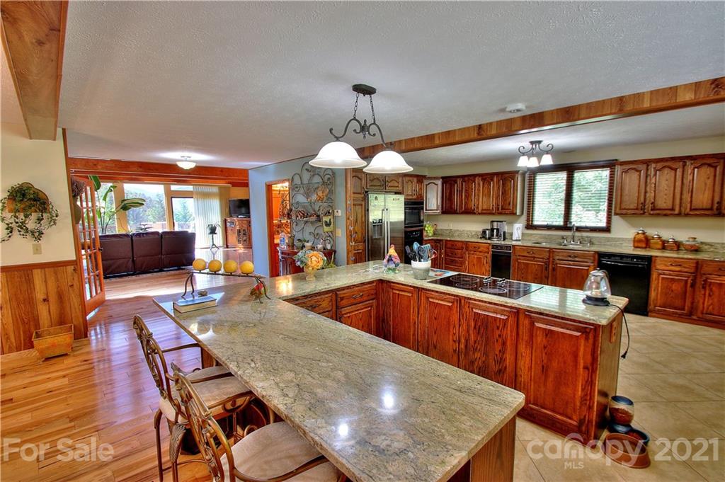 72 Slow Lane Canton, NC 28716 - Photo 11 of 47 a large kitchen with lots of counter space and windows