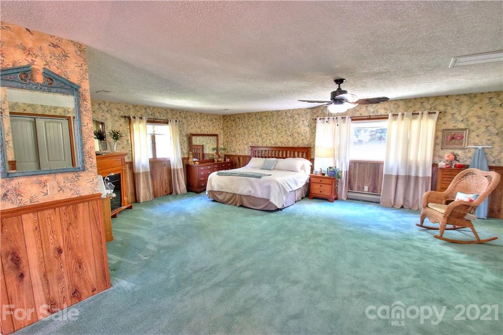 72 Slow Lane Canton, NC 28716 - Photo 16 of 47 a living room with furniture and a chandelier