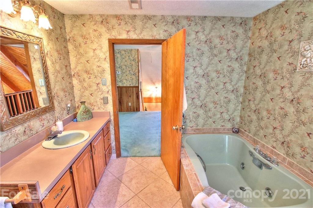 72 Slow Lane Canton, NC 28716 - Photo 19 of 47 a bathroom with a bathtub sink and toilet