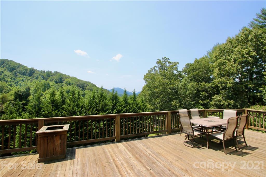72 Slow Lane Canton, NC 28716 - Photo 33 of 47 a view of a deck with two chairs and wooden floor