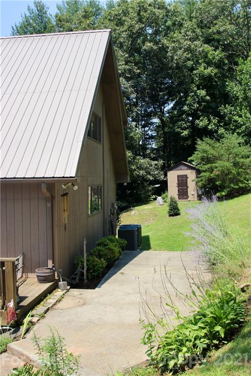 72 Slow Lane Canton, NC 28716 - Photo 40 of 47 a view of backyard with barbeque grill and wooden fence