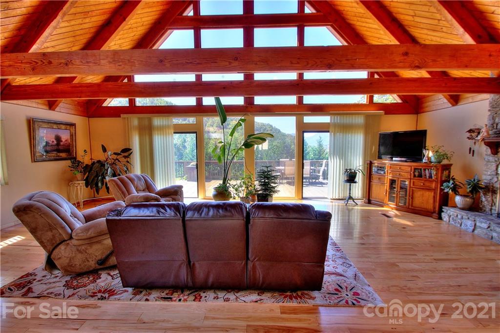 72 Slow Lane Canton, NC 28716 - Photo 5 of 47 a living room with furniture and a floor to ceiling window