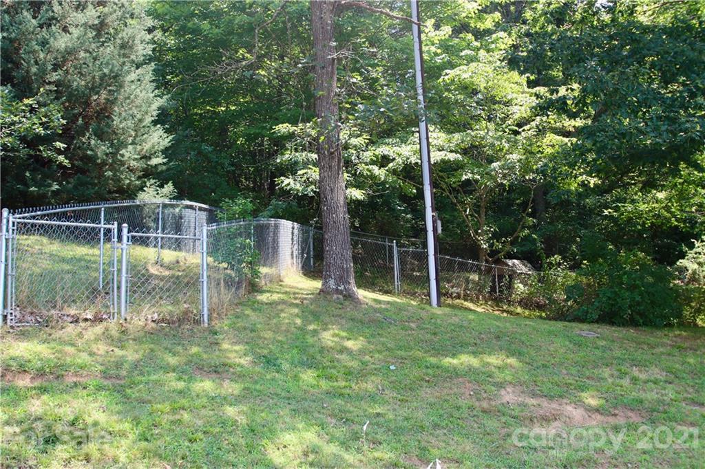 72 Slow Lane Canton, NC 28716 - Photo 47 of 47 a backyard of a house with table and chairs