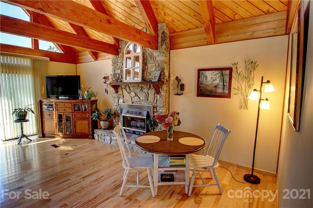 72 Slow Lane Canton, NC 28716 - Photo 7 of 47 a dining room with furniture and a flat screen tv