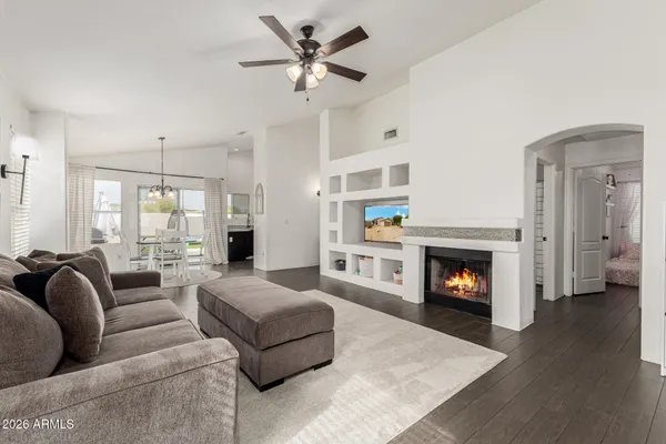 a living room with furniture and a fireplace