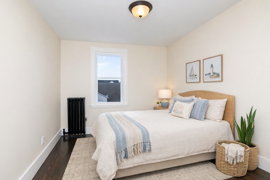 180 Shirley Street, Unit 3 Winthrop, MA 02152 - Photo 14 of 18 a bedroom with a bed and painting on the wall