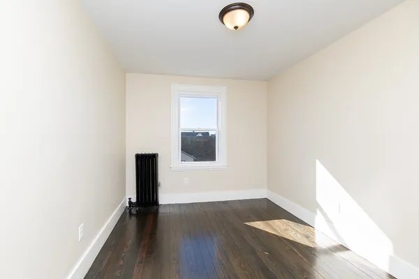 a view of a livingroom with wooden floor