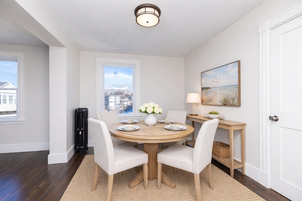 180 Shirley Street, Unit 3 Winthrop, MA 02152 - Photo 3 of 18 a view of a dining room with furniture and wooden floor