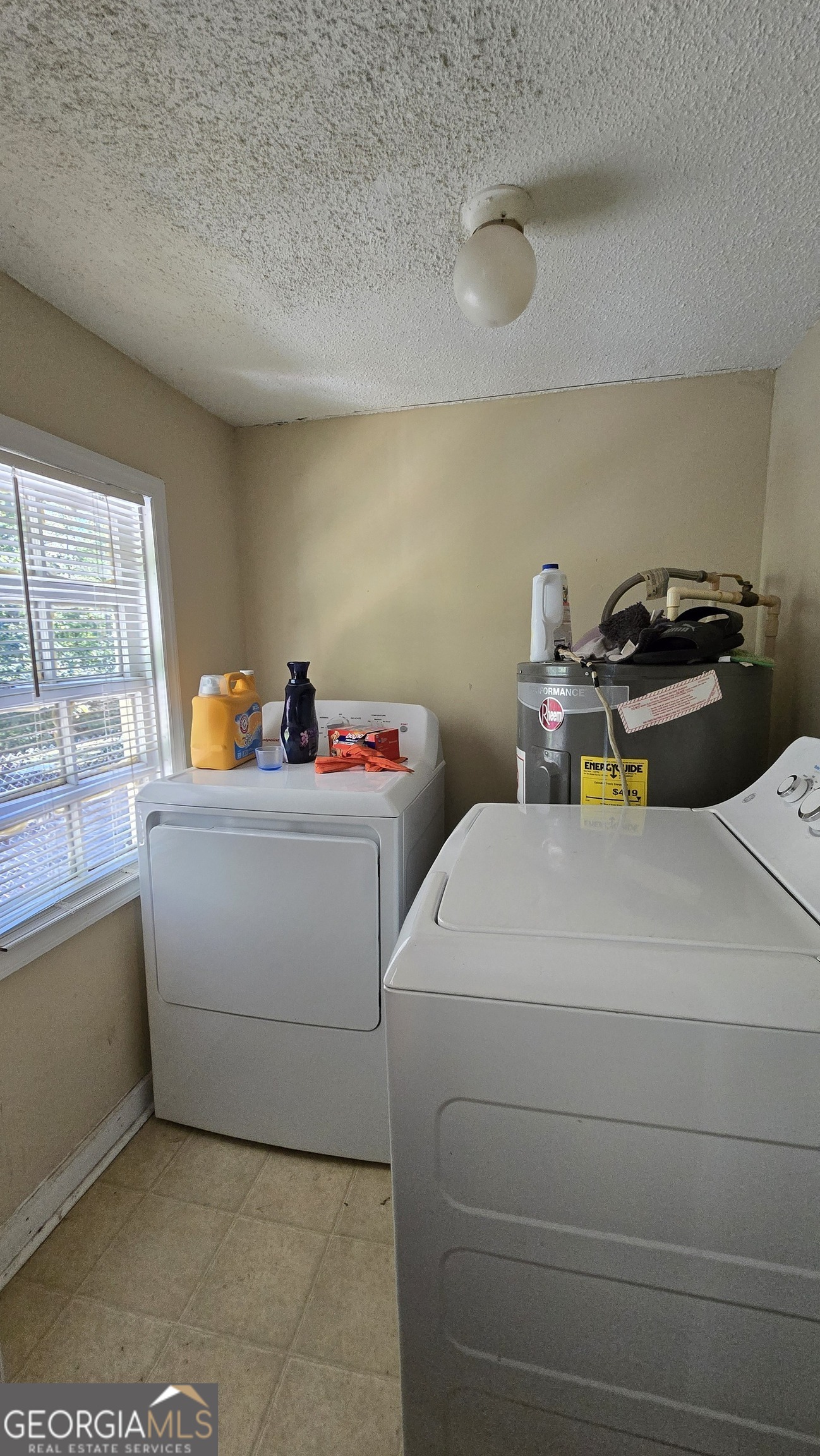 377 Dock Hyde Road Carrollton, GA 30116 - Photo 31 of 31 a utility room with dryer and washer