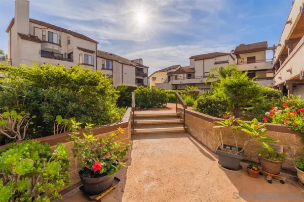 a view of a building with potted plants