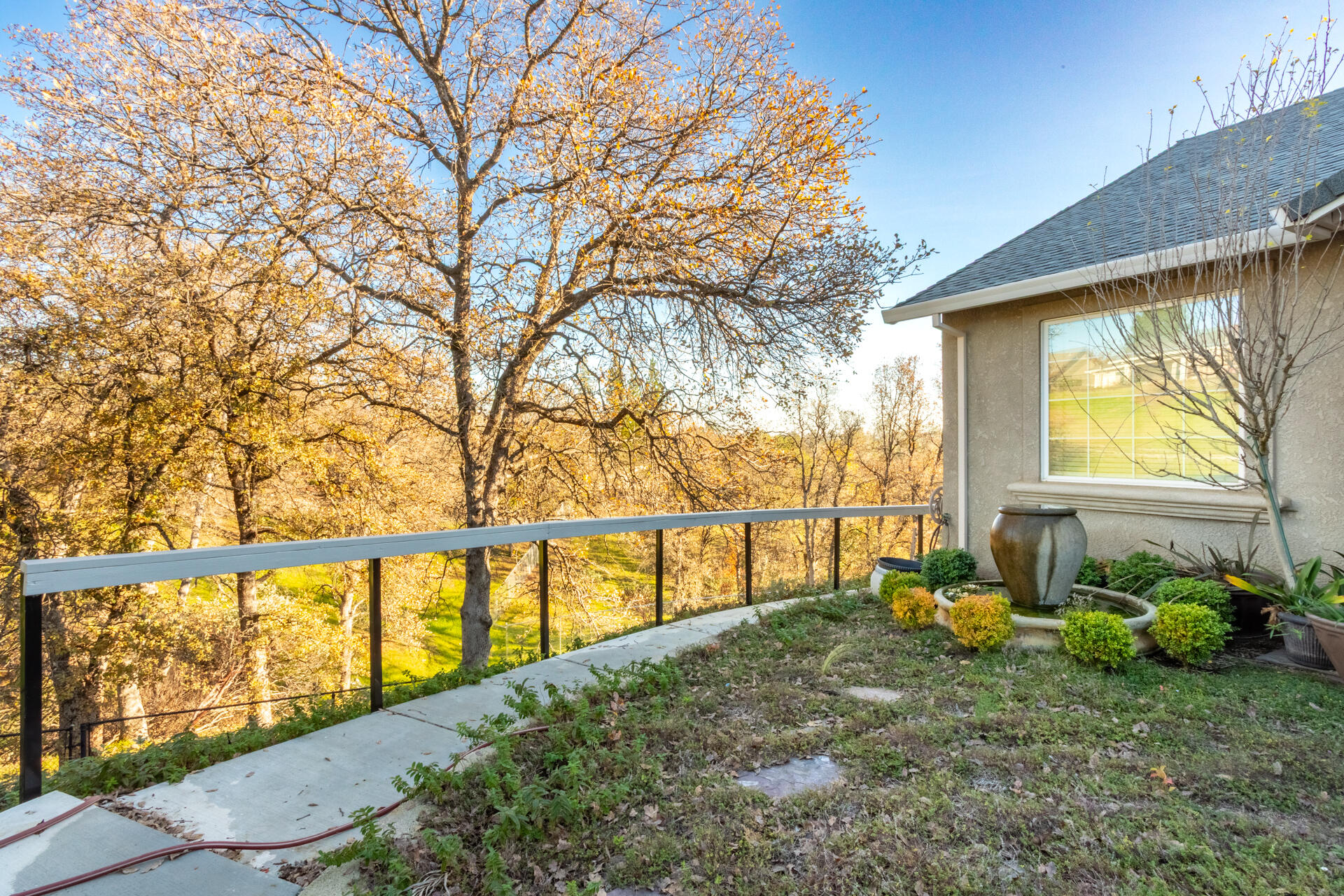 790 Volcano View Trail Redding, CA 96003 - Photo 32 of 47 Concrete pathway aound home