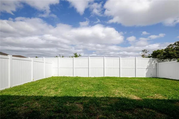 a view of a wrought iron fences in front of a yard