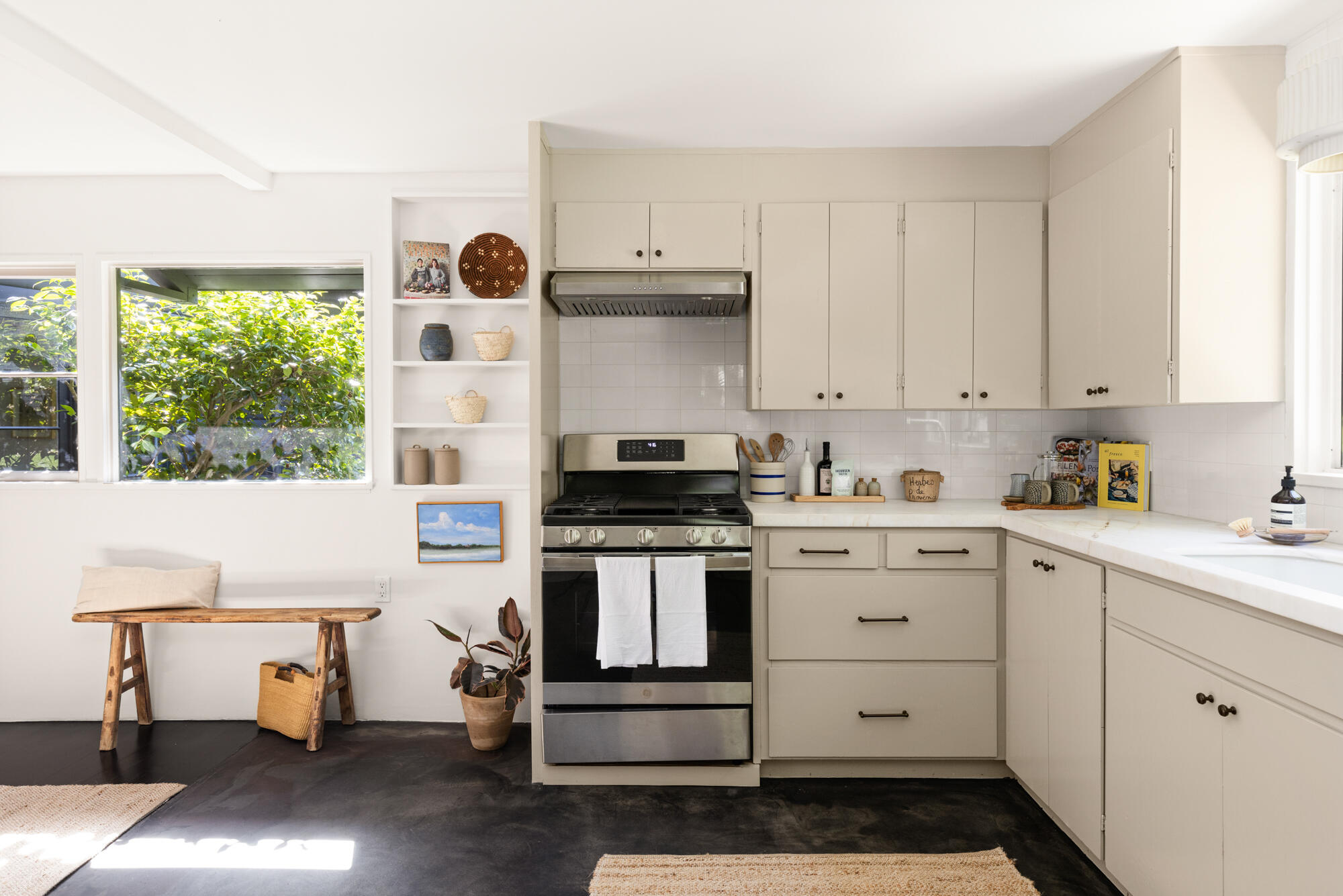2070 East Valley Road Montecito, CA 93108 - Photo 13 of 34 a kitchen with a stove and white cabinets