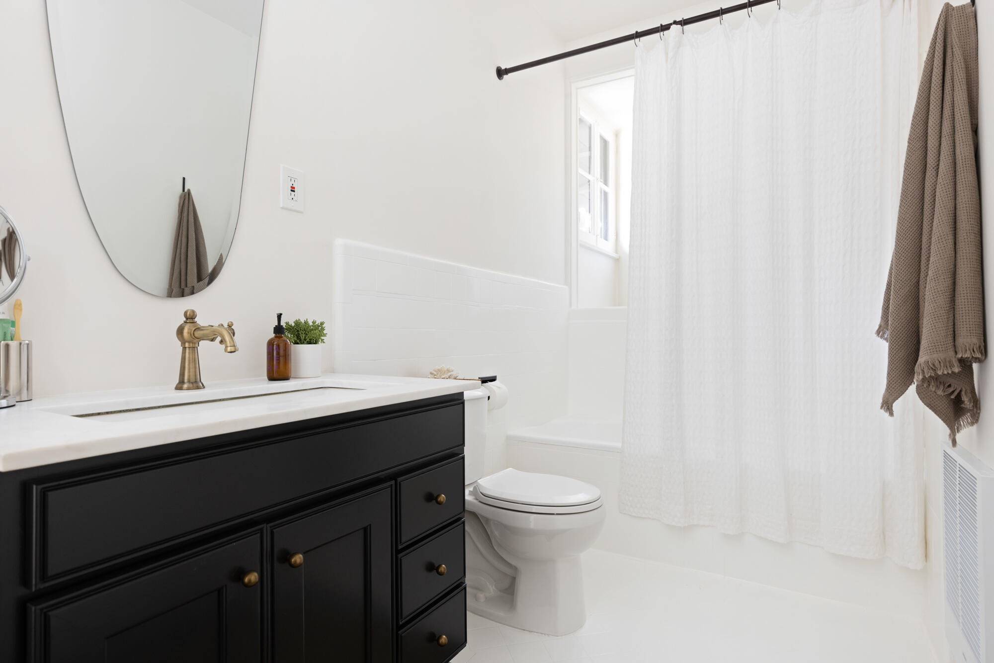 2070 East Valley Road Montecito, CA 93108 - Photo 19 of 34 a bathroom with a sink vanity mirror and toilet