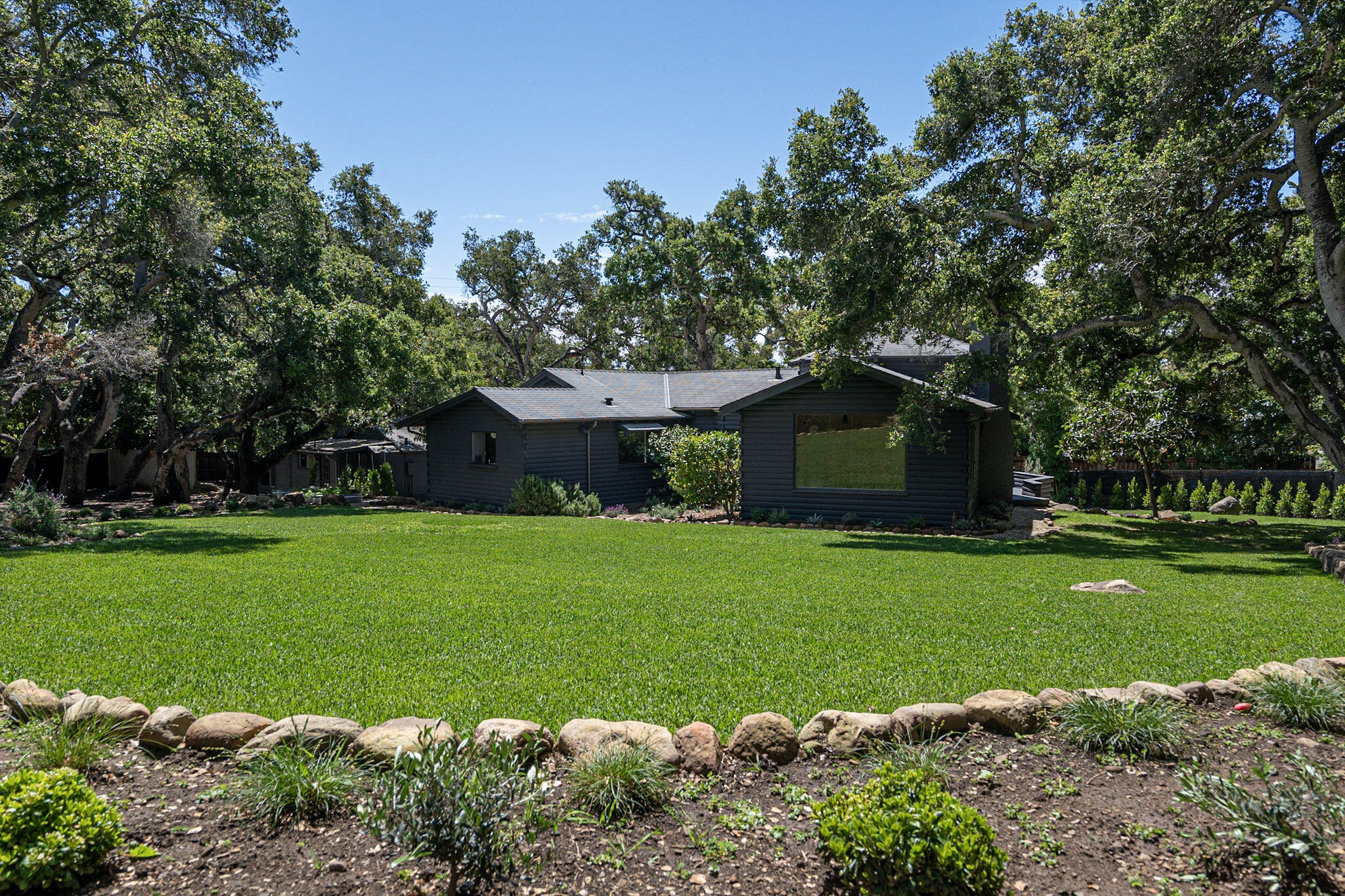 2070 East Valley Road Montecito, CA 93108 - Photo 25 of 34 a front view of a house with garden
