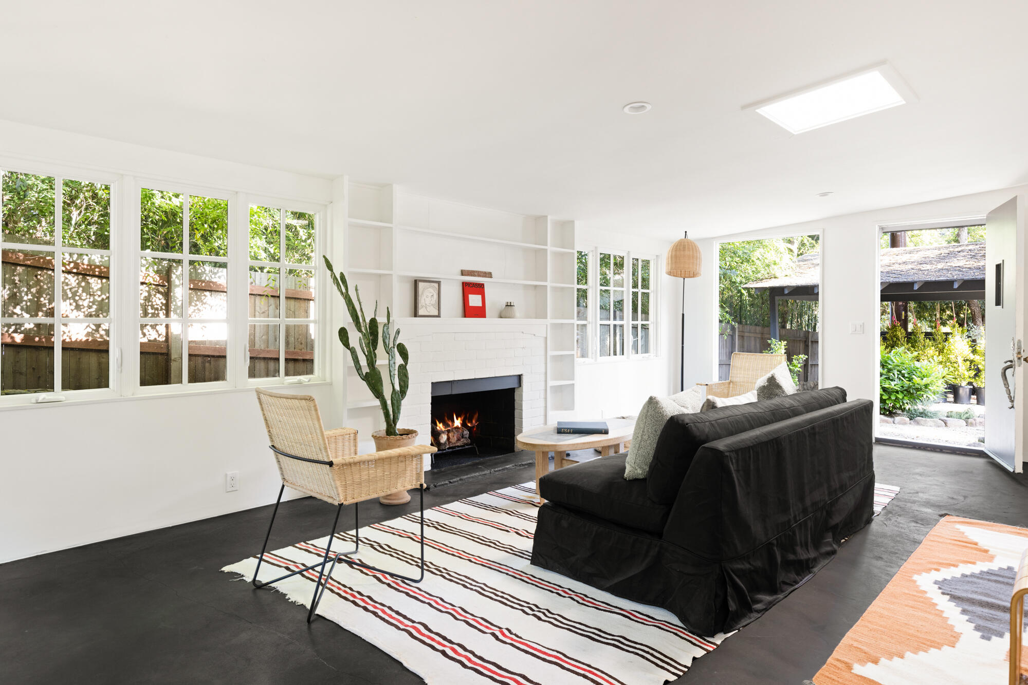 2070 East Valley Road Montecito, CA 93108 - Photo 29 of 34 a living room with furniture a large window and a fireplace