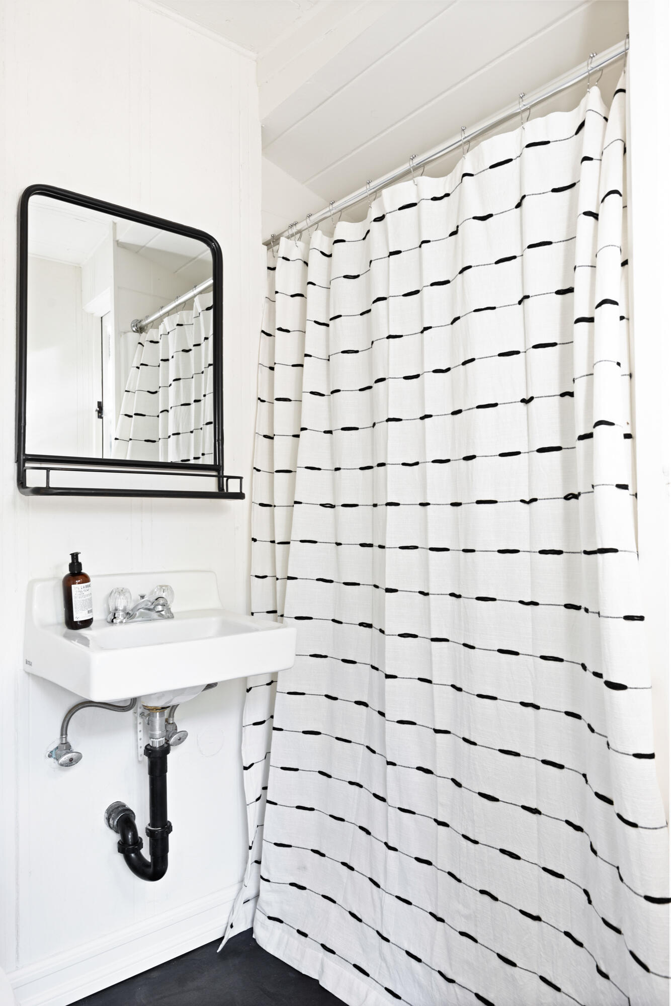 2070 East Valley Road Montecito, CA 93108 - Photo 31 of 34 a bathroom with a sink and a mirror