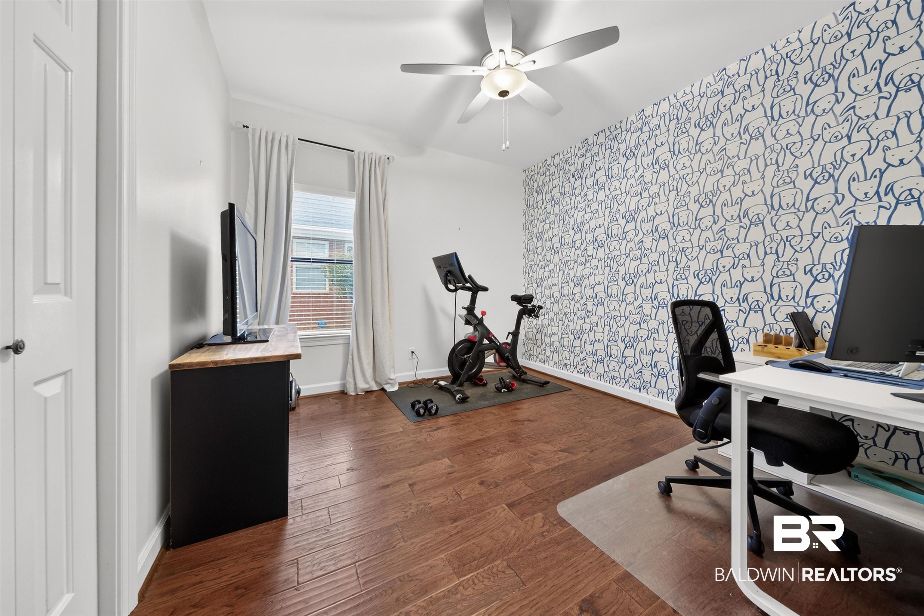 1250 Savannah Drive Mobile, AL 36609 - Photo 21 of 35 Office featuring dark wood-style floors, wallpapered walls, ceiling fan, and an accent wall