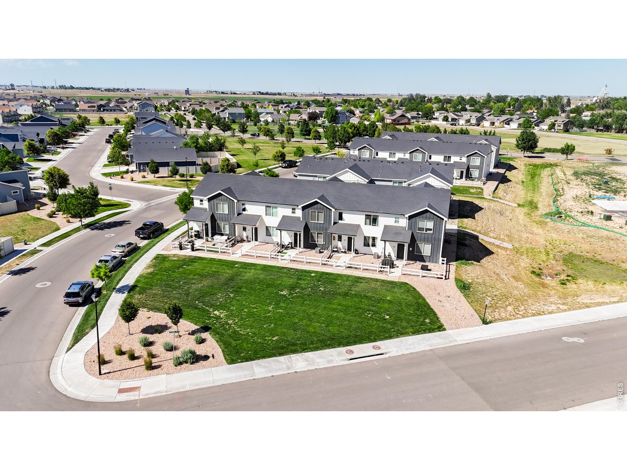 260 Pawnee Road, Unit D3 Ault, CO 80610 - Photo 32 of 44 Front aerial view with green space.