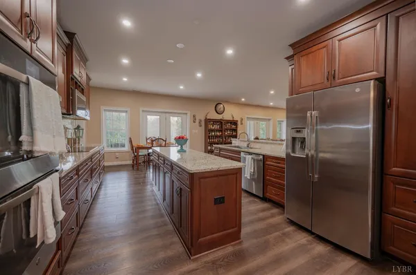 a view of a a dining room with furniture window and wooden floor