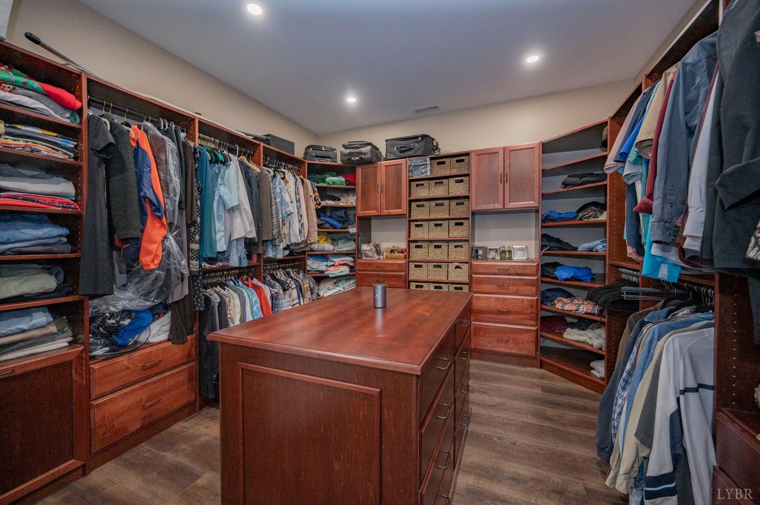 1080 Tranquility Lane Goode, VA 24556 - Photo 15 of 65 a view of walk in closet with clothes and shoes