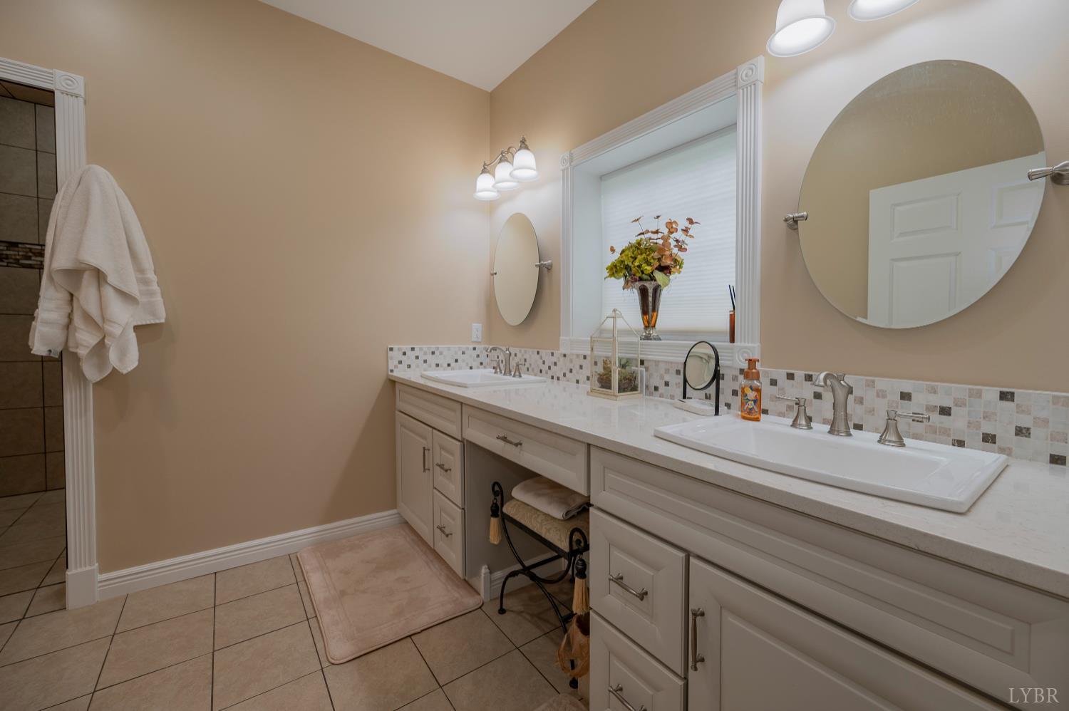1080 Tranquility Lane Goode, VA 24556 - Photo 16 of 65 a bathroom with a sink and a mirror
