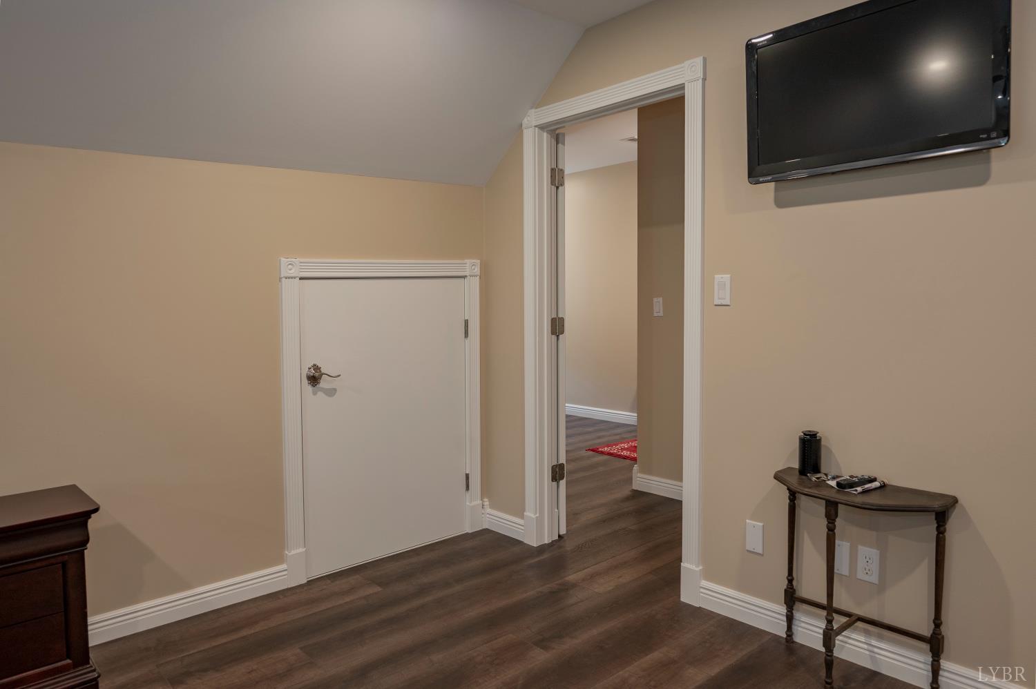 1080 Tranquility Lane Goode, VA 24556 - Photo 21 of 65 a view of a livingroom with wooden floor and a flat screen tv