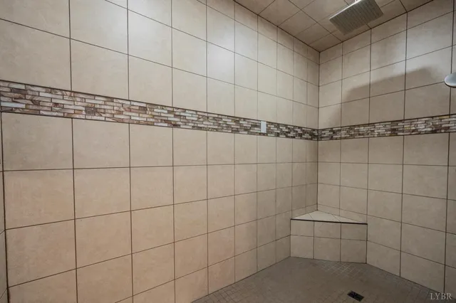a view of a hallway with wooden floor and furniture