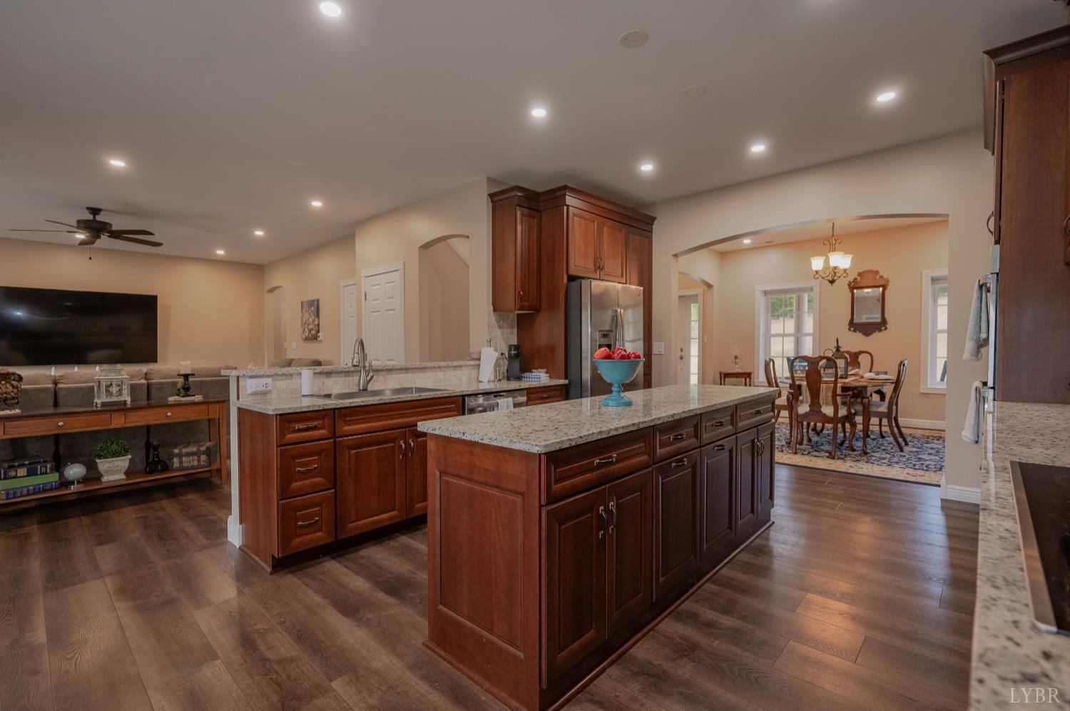 1080 Tranquility Lane Goode, VA 24556 - Photo 3 of 65 a kitchen with stainless steel appliances granite countertop a stove and a wooden floors