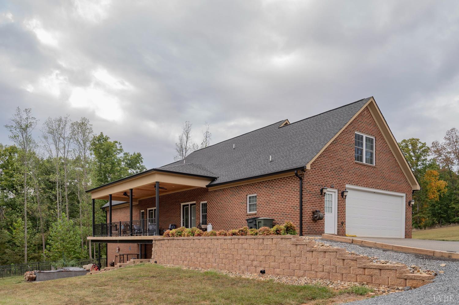 1080 Tranquility Lane Goode, VA 24556 - Photo 35 of 65 a front view of a house with a yard