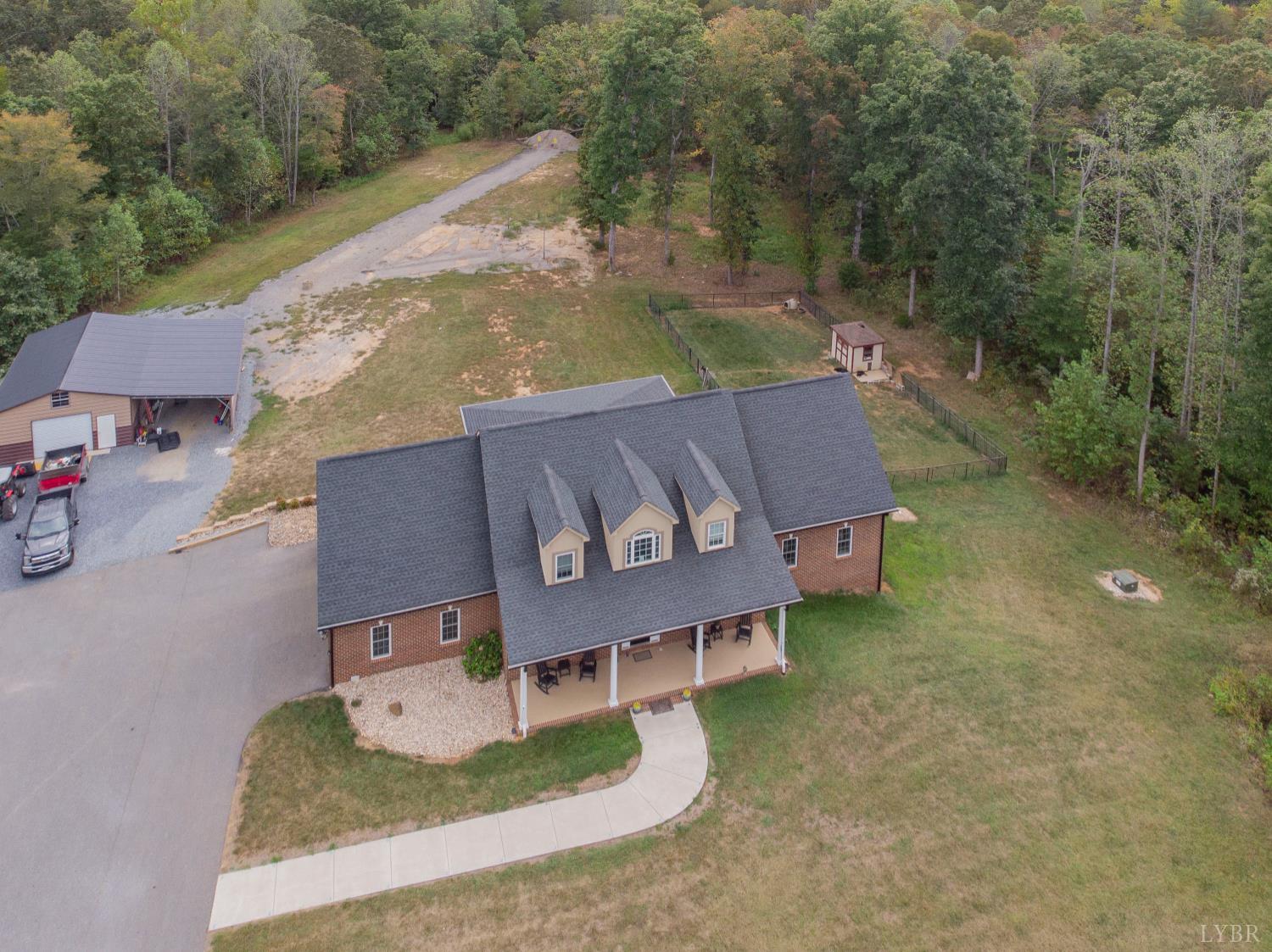 1080 Tranquility Lane Goode, VA 24556 - Photo 42 of 65 an aerial view of a house with garden space and street view
