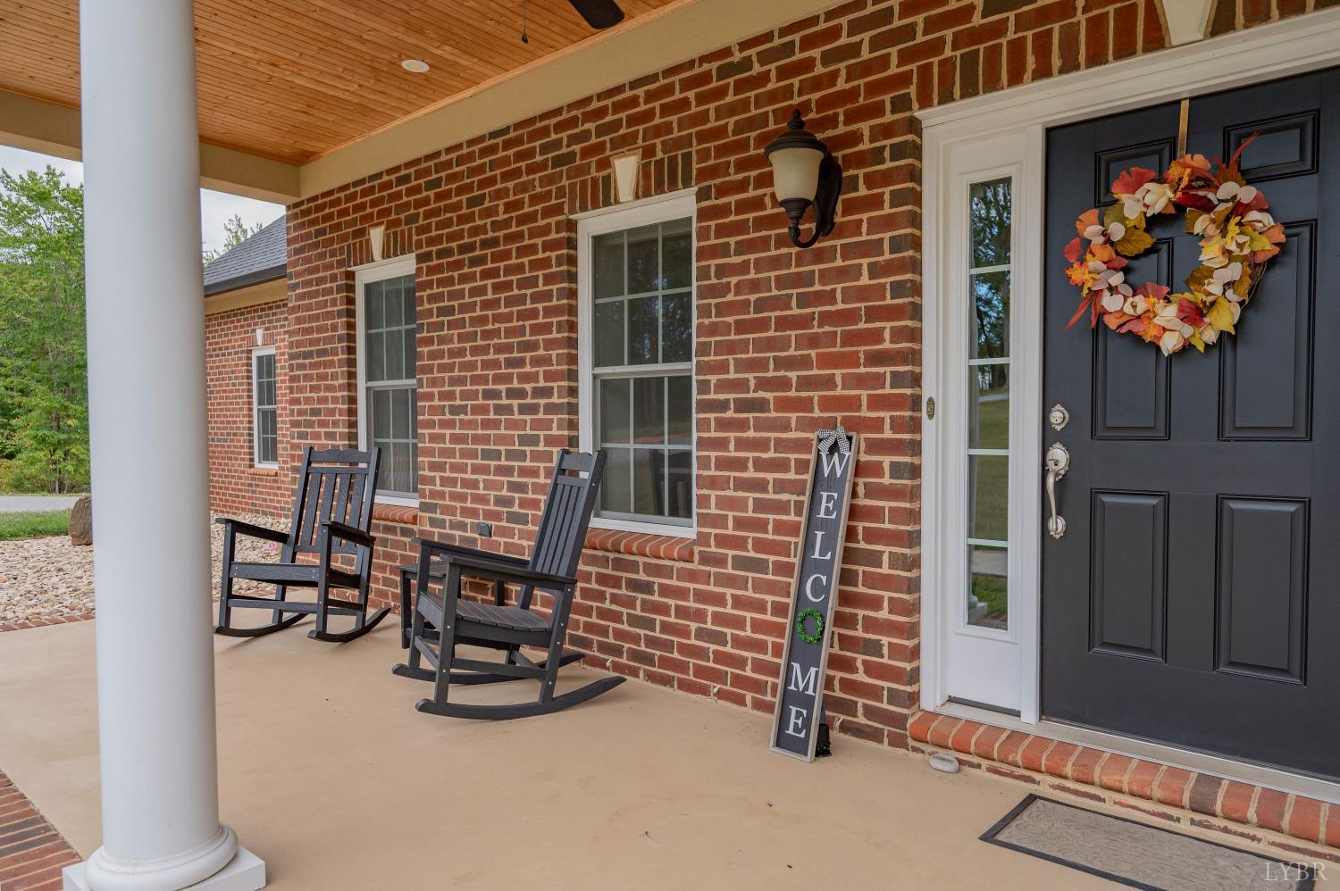 1080 Tranquility Lane Goode, VA 24556 - Photo 47 of 65 a backyard of a house with barbeque oven table and chairs