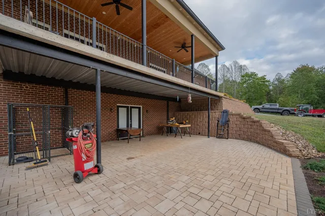 an aerial view of a house with garden space and street view