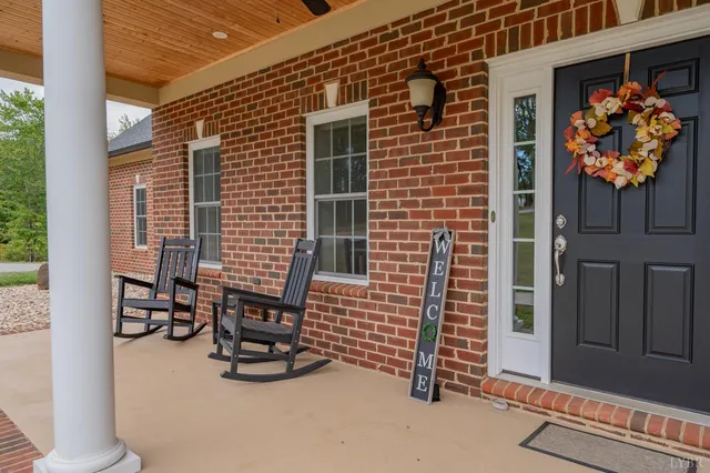 a view of a livingroom with wooden floor and stairs