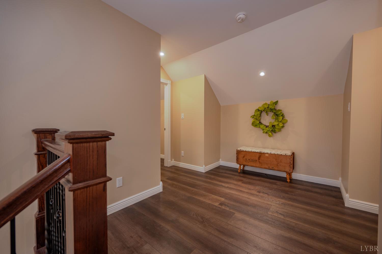 1080 Tranquility Lane Goode, VA 24556 - Photo 57 of 65 a view of a hallway with wooden floor and furniture