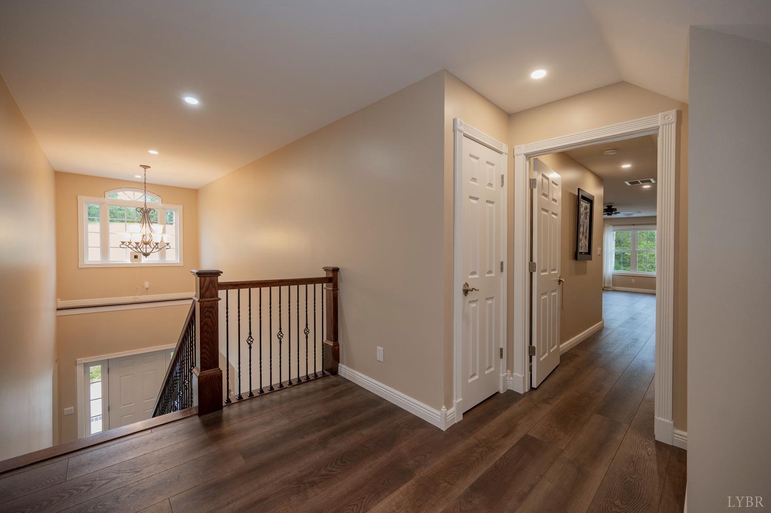 1080 Tranquility Lane Goode, VA 24556 - Photo 58 of 65 a view of a hallway with wooden floor and closet