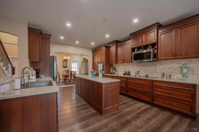 a kitchen with cabinets and stainless steel appliances